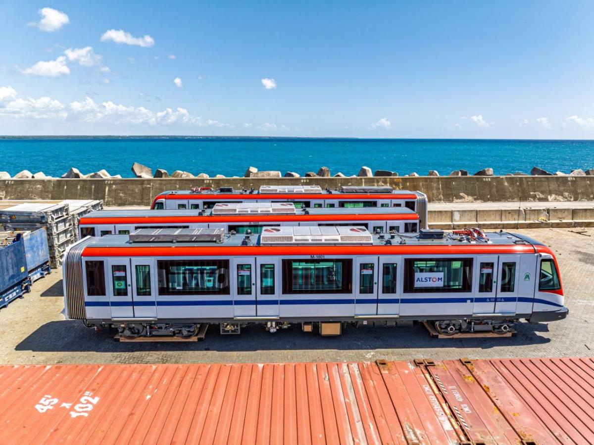 subway cars with ocean in background 