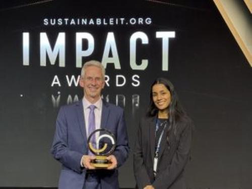 Colin Seward and Sneha Balasubramanian from Cisco’s Chief Sustainability Office accept the award from SustainableIT.org " "