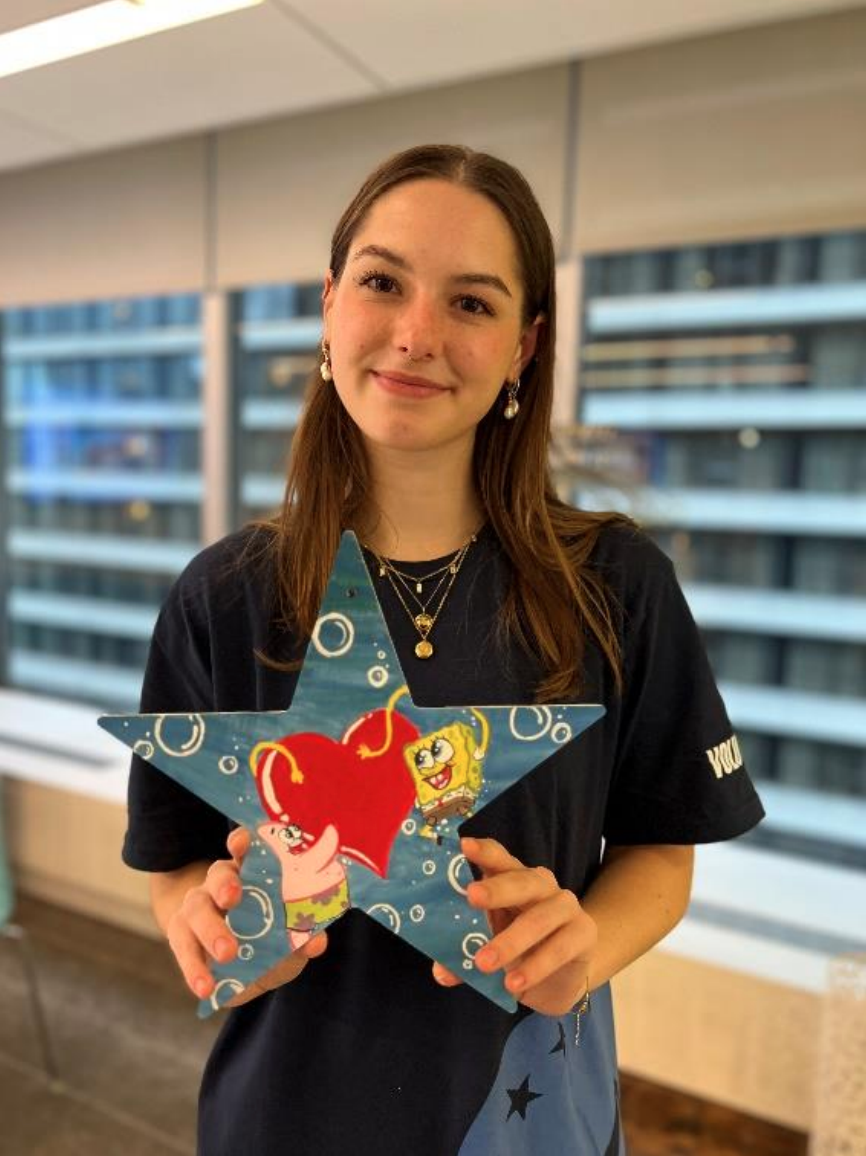 intern holding a SpongeBob painted star