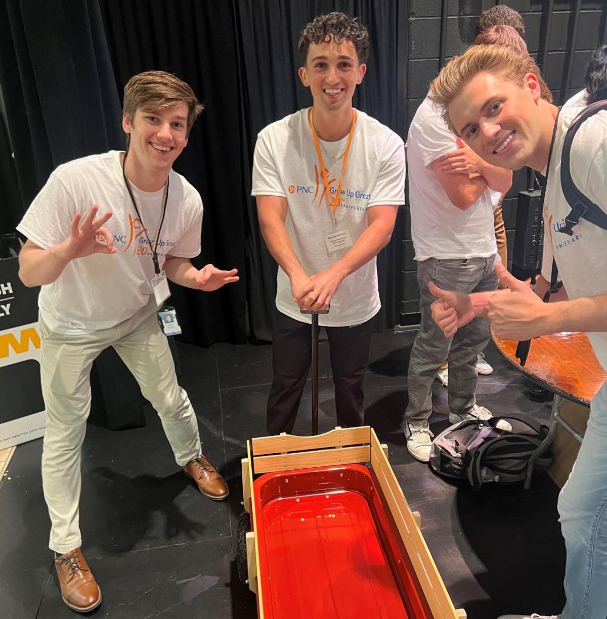 Volunteers posed by a finished wagon.