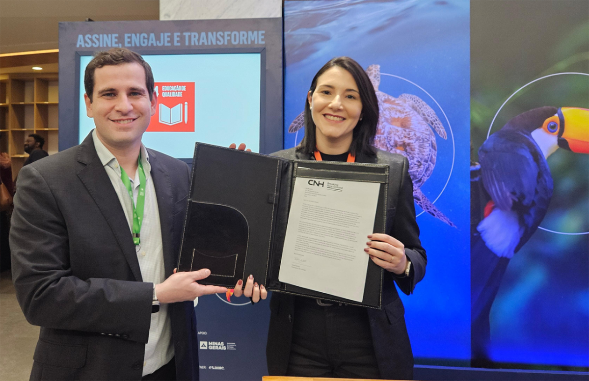 Two people holding a folder