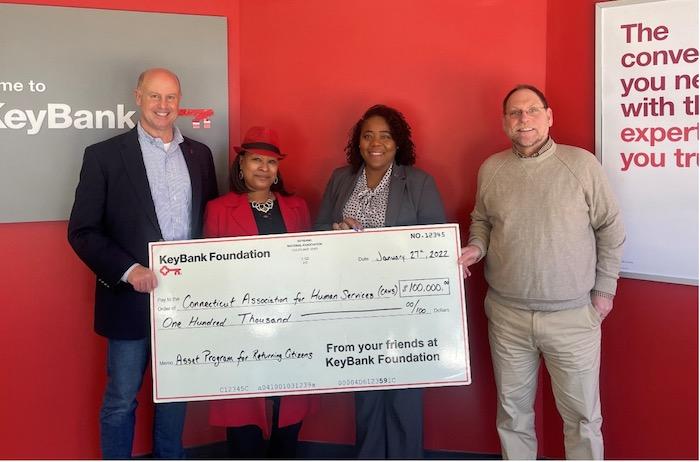 Photo caption: KeyBank’s Market President James Barger (left) and Corporate Responsibility Officer LaKisha Jordan (center right) present a $100,000 grant to CAHS CEO John Merz (right) and Director of Asset Building Programs Takima Robinson (center left).  Photo credit:  KeyBank 