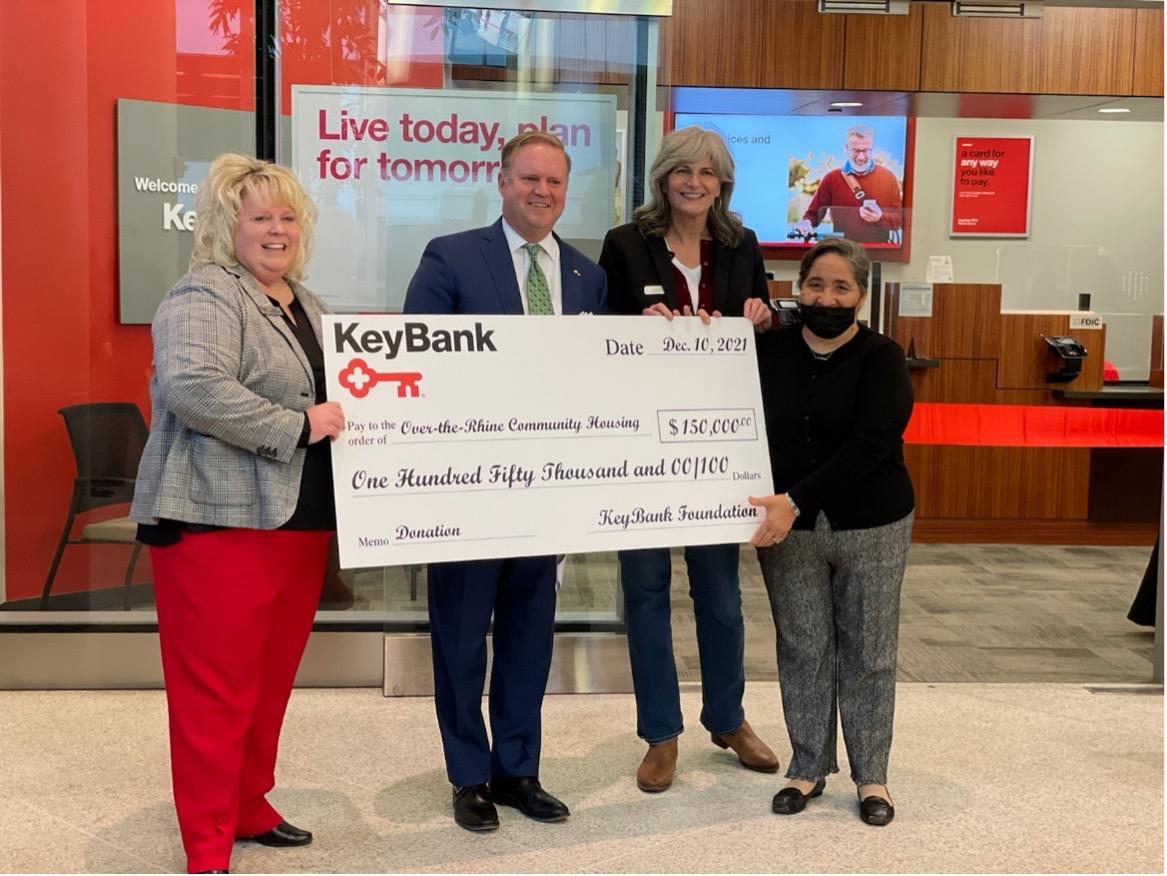 (From left) KeyBank Regional Retail Leader Stacy Radabaugh and Market President Michael McCuen present a KeyBank Foundation grant of $150,000 to Over-The-Rhine Community Housing Executive Director Mary Burke Rivers and OTRCH Board Vice President Georgia Keith. (From left) KeyBank Regional Retail Leader Stacy Radabaugh and Market President Michael McCuen present a KeyBank Foundation grant of $150,000 to Over-The-Rhine Community Housing Executive Director Mary Burke Rivers and OTRCH Board Vice President Georgia Keith. Group is holding a large KeyBank check for $150,000.
