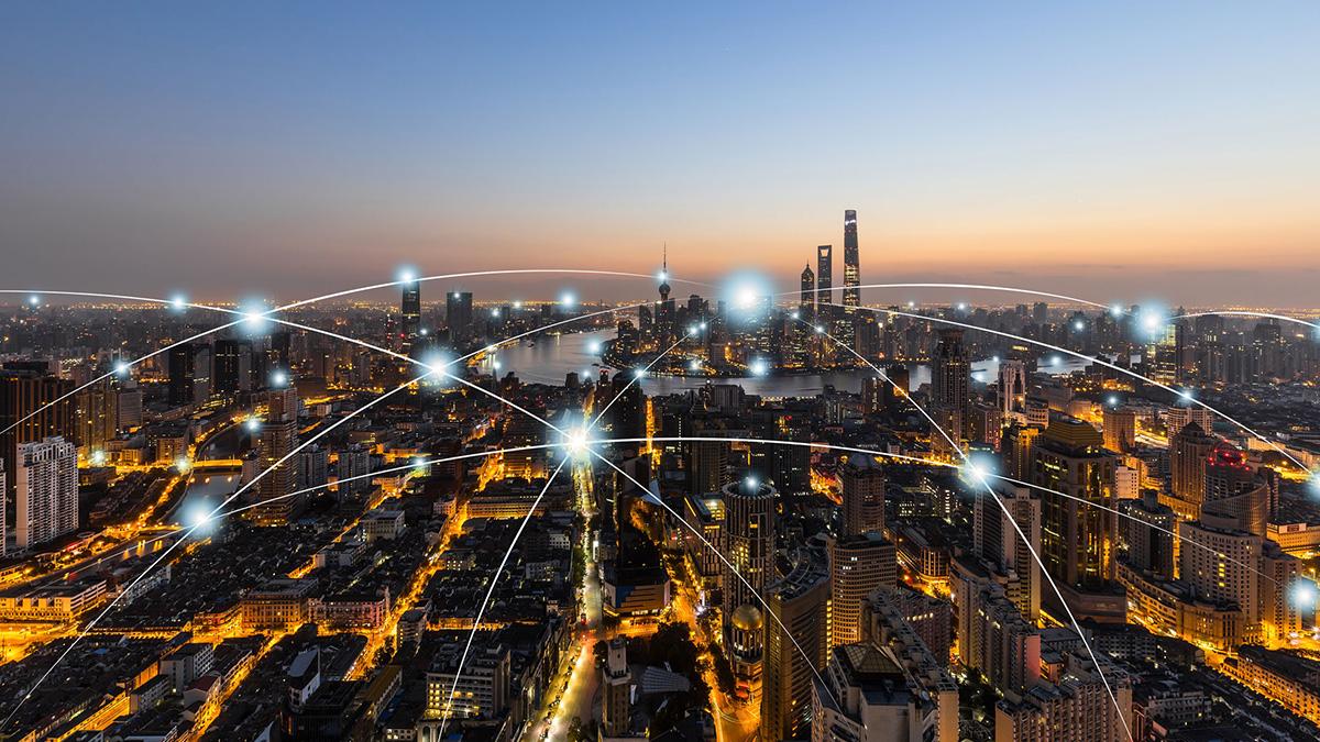 a web of interconnected lights floating over a city skyline