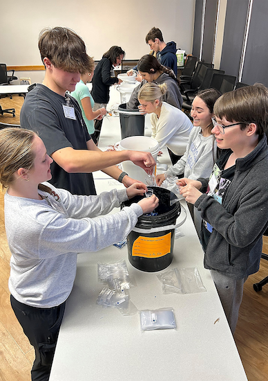 Students shown recycling.