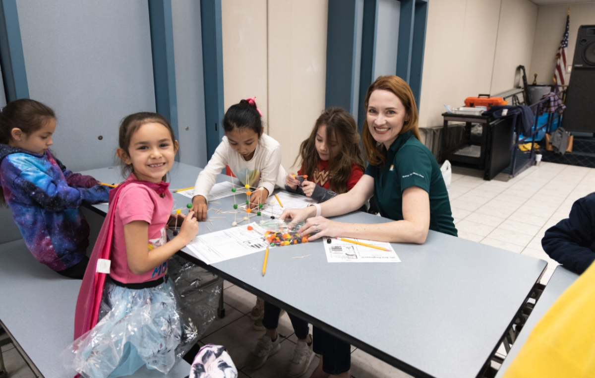 Kids at a table with Jill Anderson