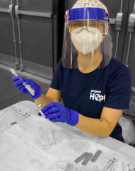 person wearing protective equipment in laboratory