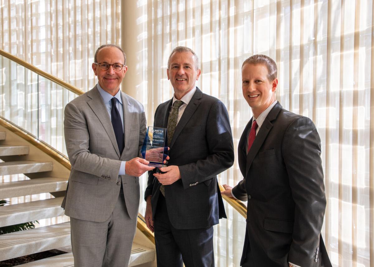 Cintas employees holding award