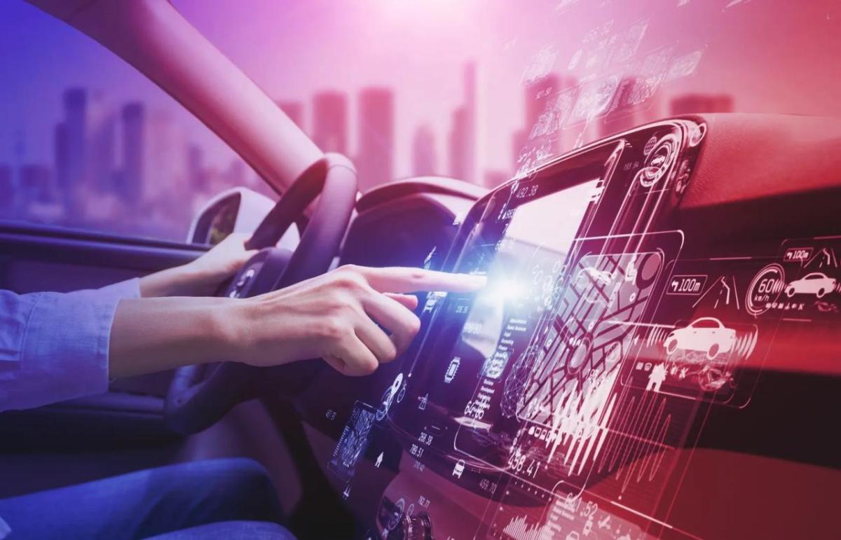 person using a console while driving