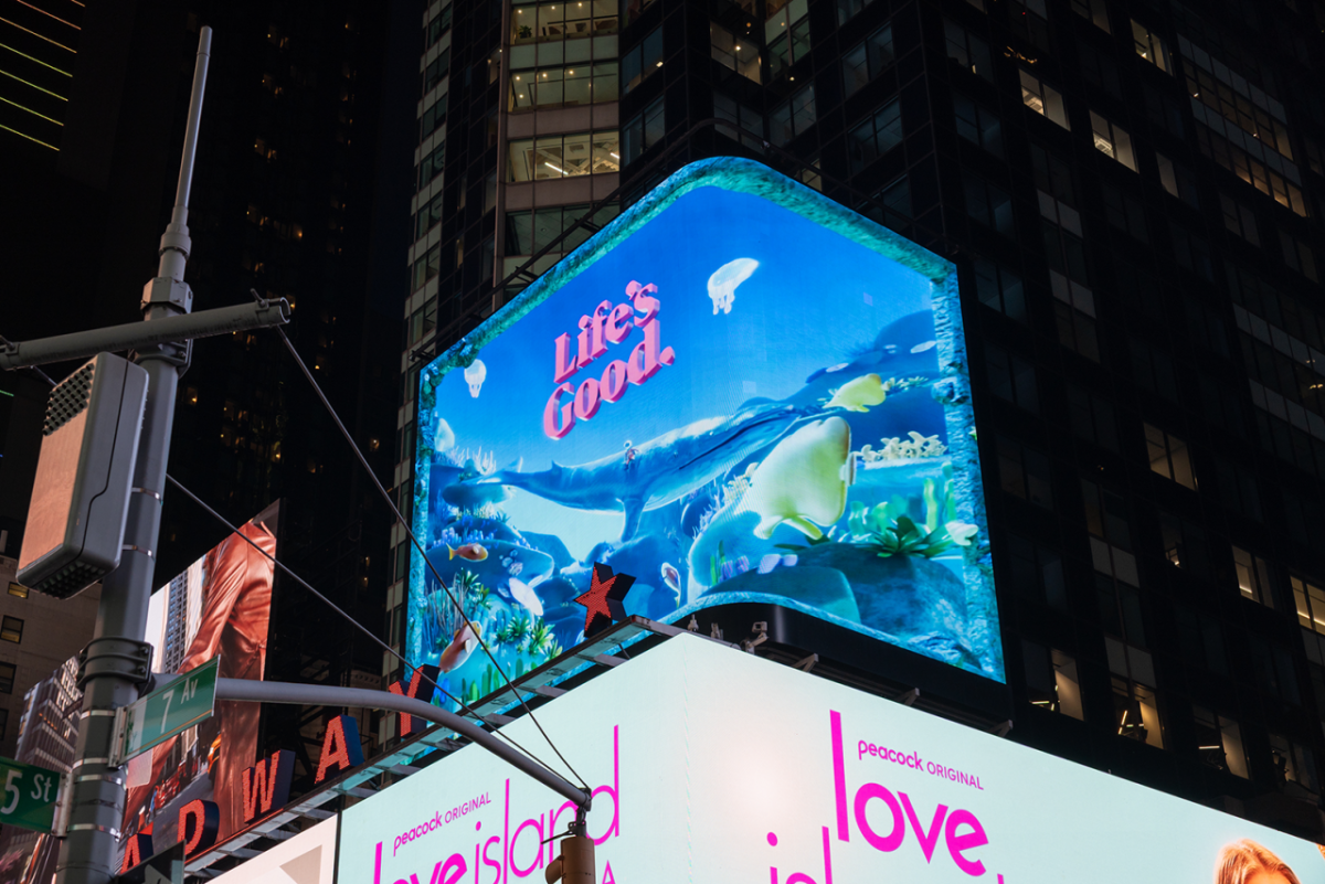 Lit billboard: "Life's Good when we protect wildlife"