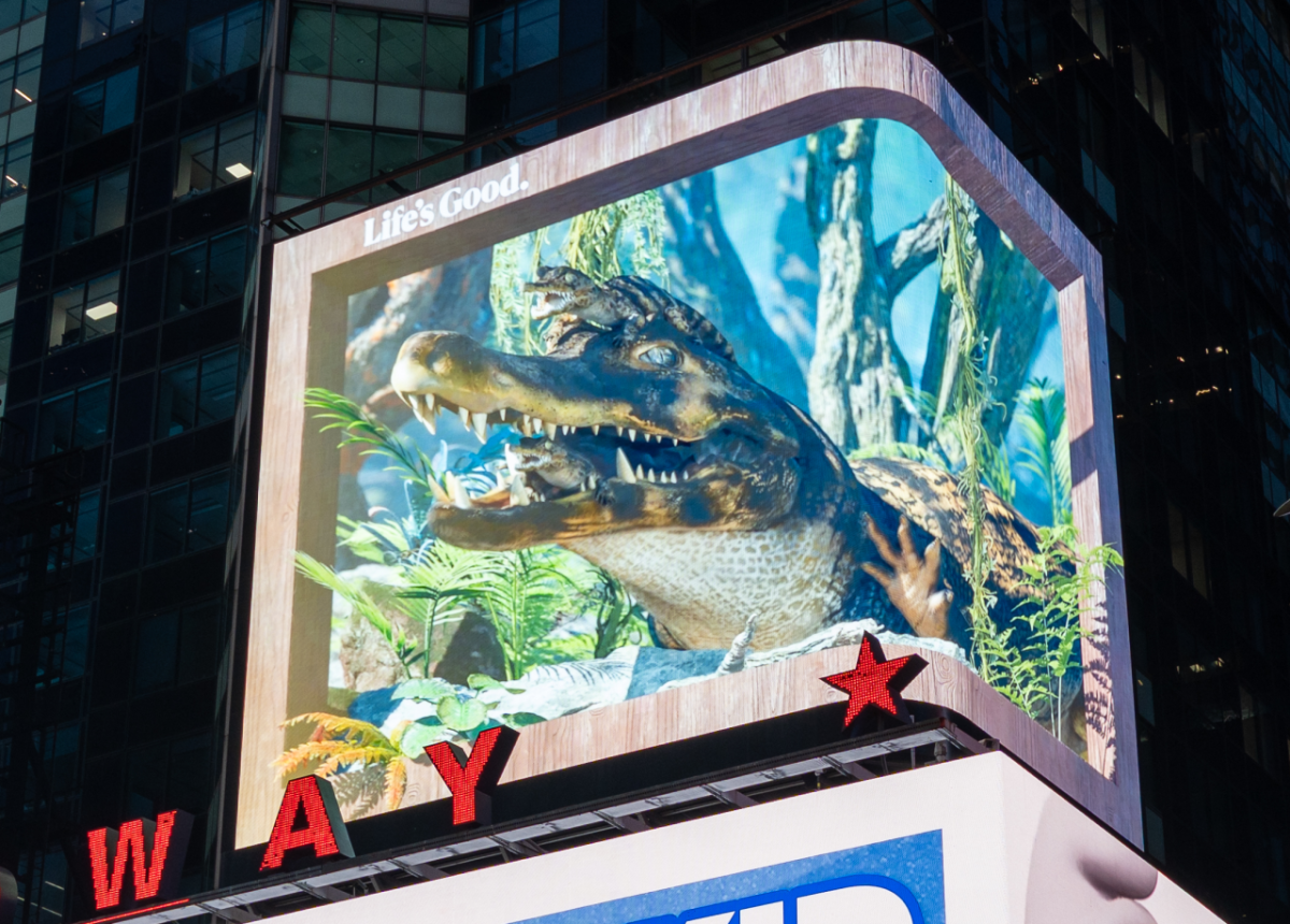 Lit billboard showing a crocodile