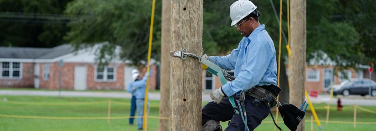 Lineworker on telephone pole