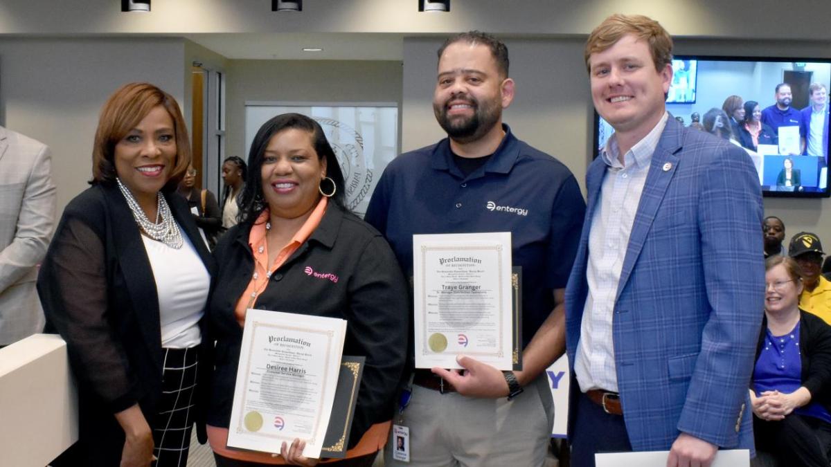 Baton Rouge Mayor-President Sharon Weston Broome is pictured with Desiree Harris, Entergy Louisiana customer service manager; Traye Granger, Entergy Louisiana region distribution operations senior manager; and Seth Schilling, region customer service manager. Broome recognized the three Entergy employees at the recent metropolitan council meeting with certificates of commendation. Four people standing together and posing for the camera