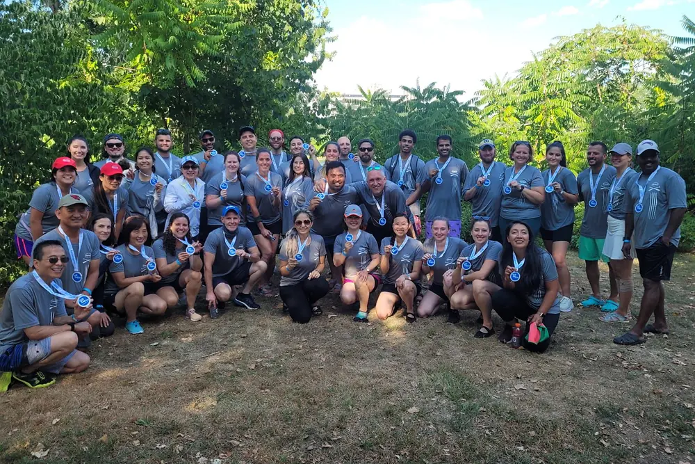 Group photo of people wearing medals