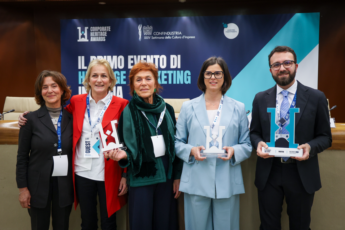 Five people holding award