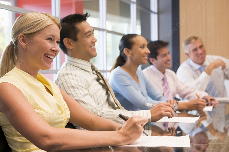 Group of people in a meeting looking cheerful