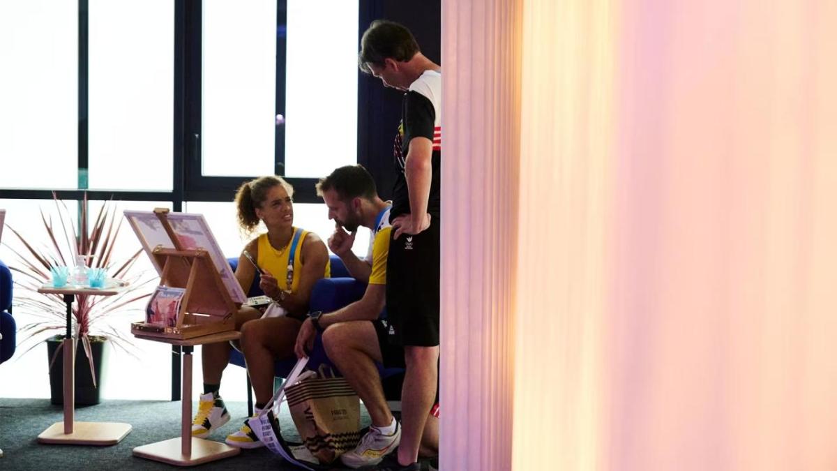 Athletes painting together