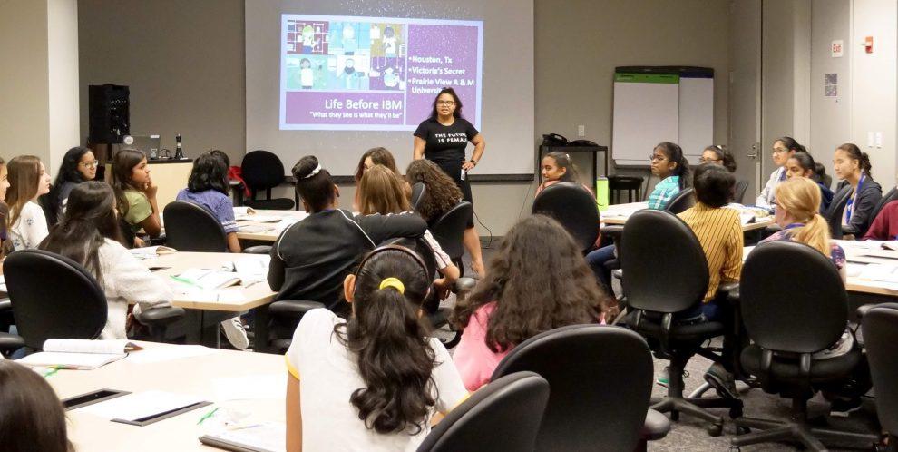 Monique Collins addresses a group of student mentees.