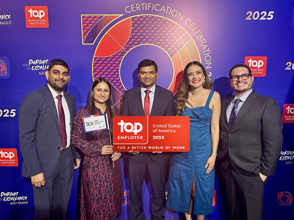 Five people holding an award