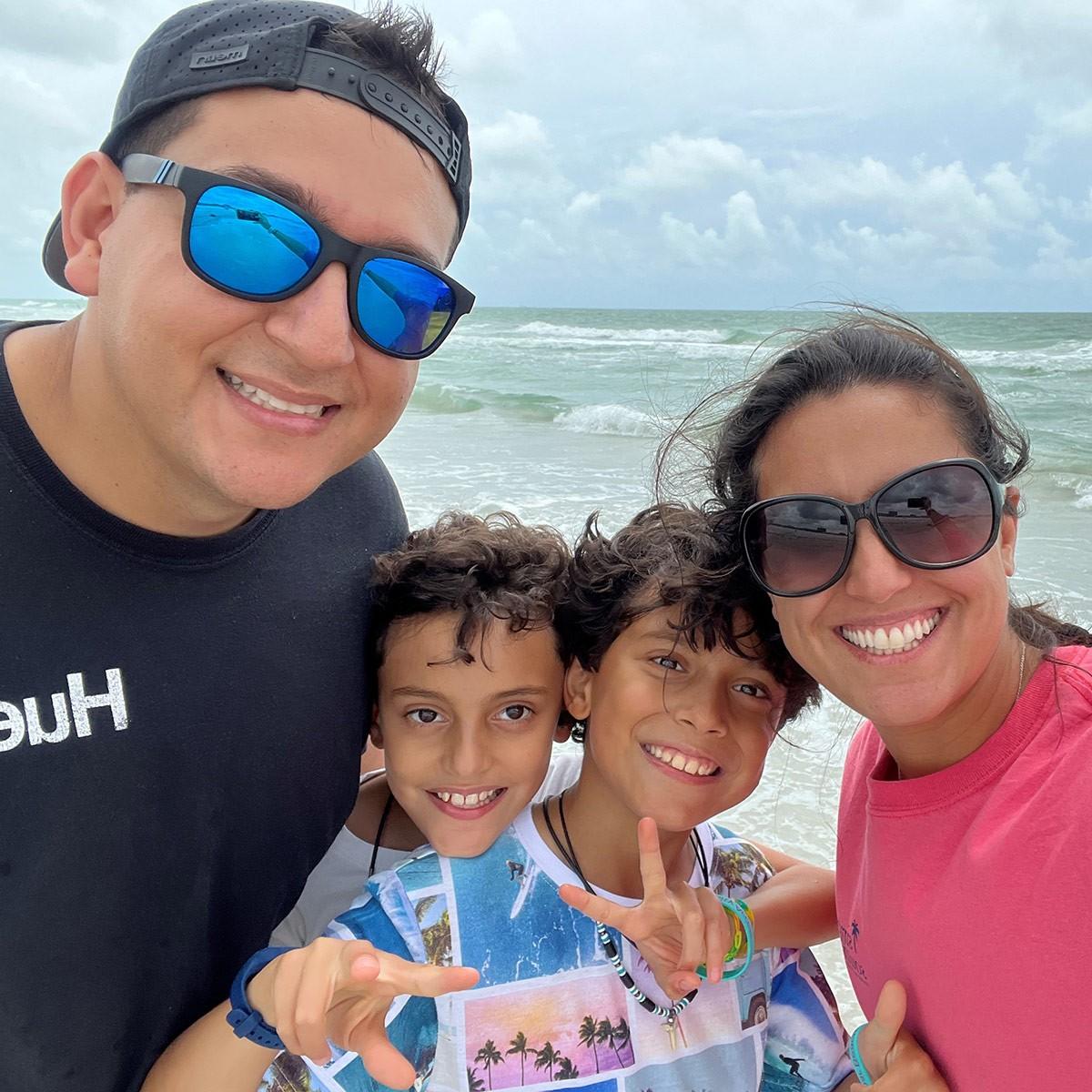 Natacha Val-Gonzalez and family at a beach