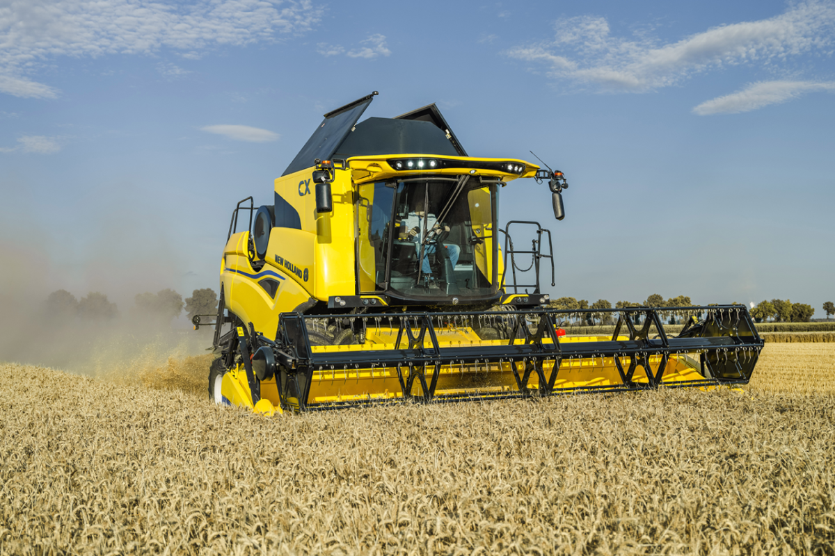 Yellow machine in action in a field
