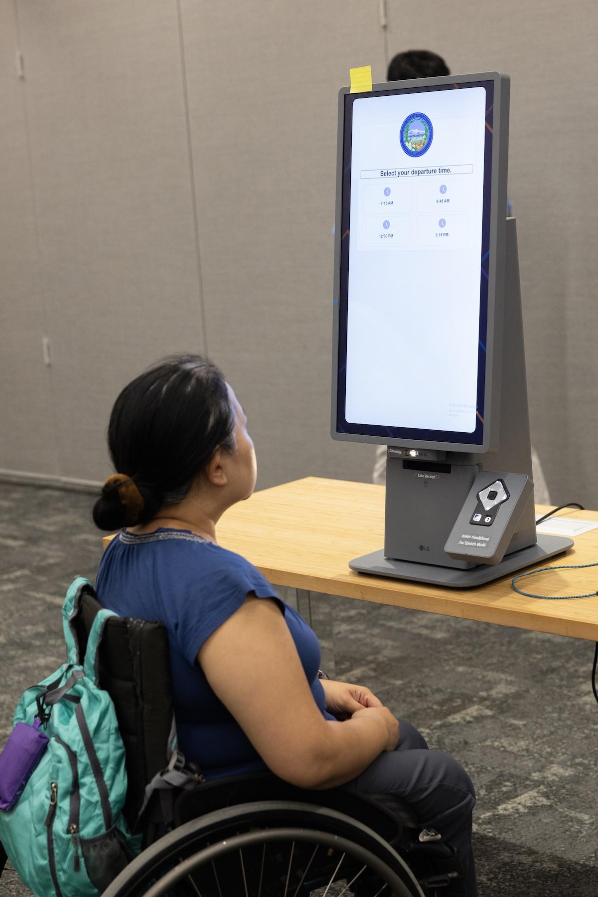 person at Self-Ordering Kiosk