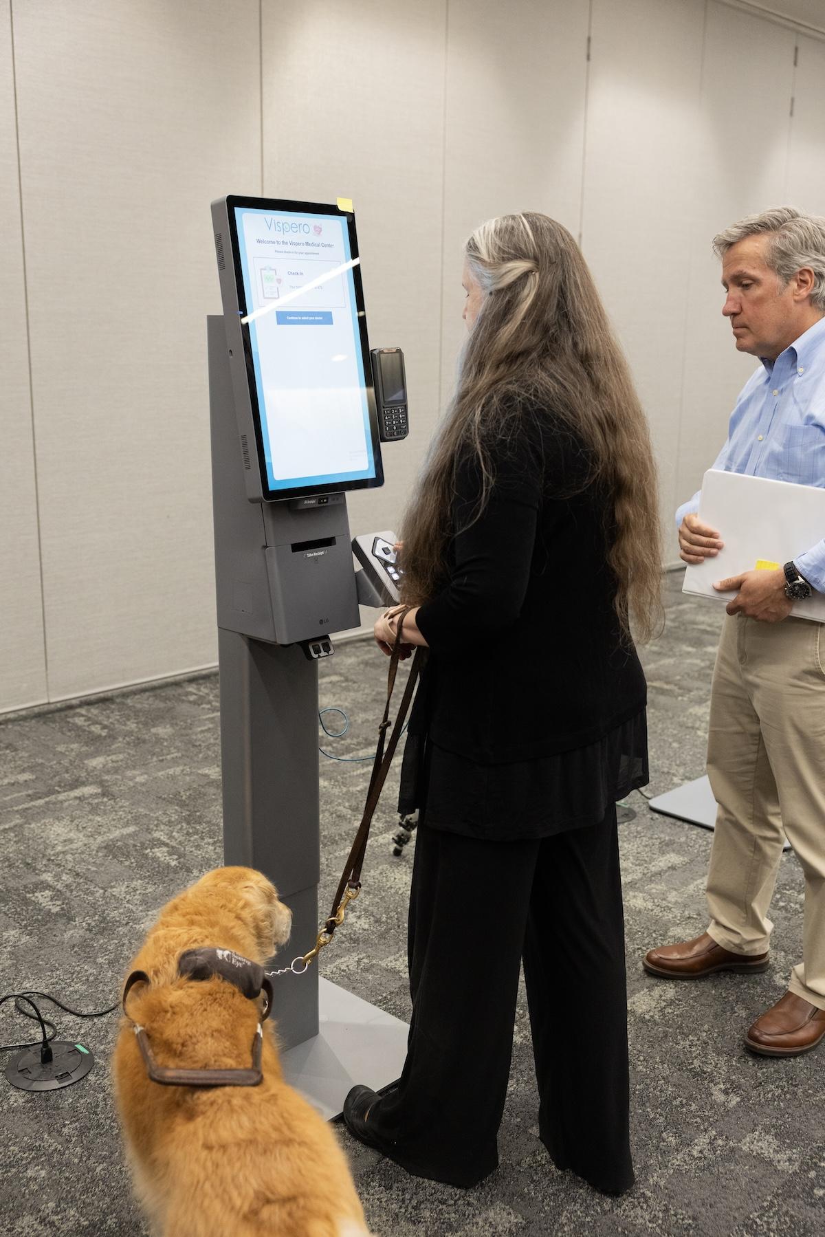 people using self-service kiosk