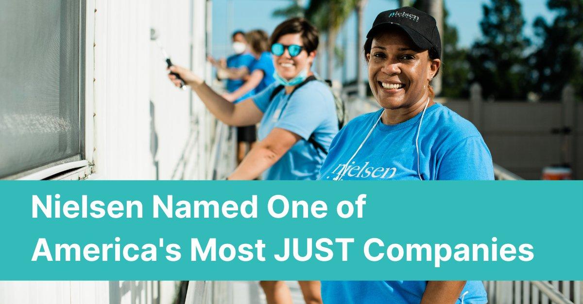 Nielsen Named One of America's Most JUST Companies: Image shows four Nielsen employees wearing Nielsen t-shirts painting a house.