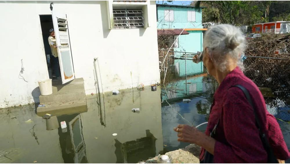 Elderly residents return to the Parcelas Selgas neighborhood of Florida, Puerto Rico, to find their homes still underwater, more than three weeks after Hurricane Maria made landfall. (Lara Cooper/Direct Relief)