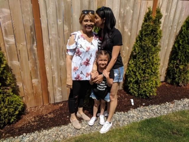 Pictured above: Niorada with her family last year