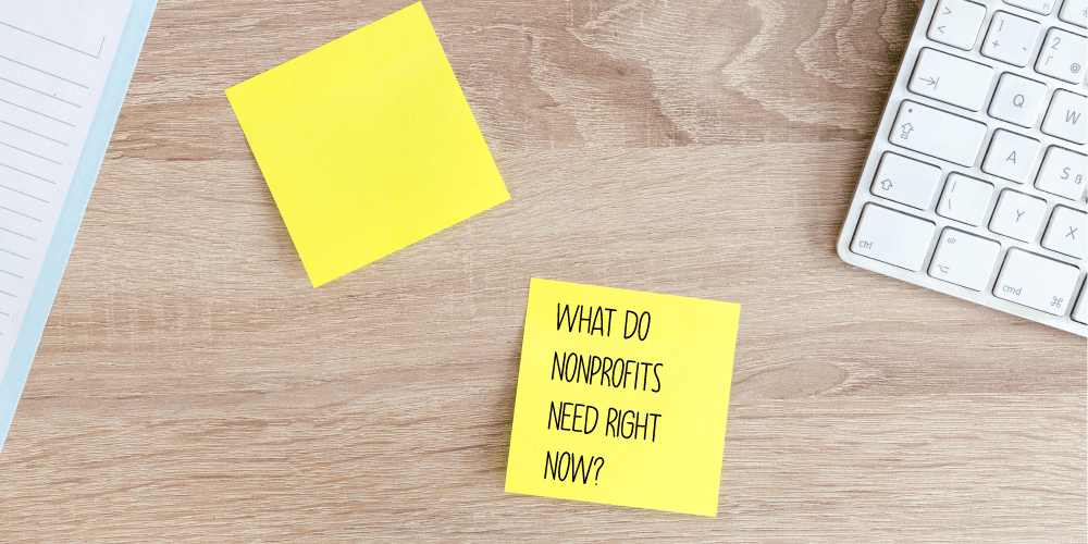 At the Taproot Foundation, we are committed to supporting nonprofits by helping them get the services and expertise the need pro bono. Pictured: sticky notes on a desk, one reads “What do Nonprofits Need Right Now?”
