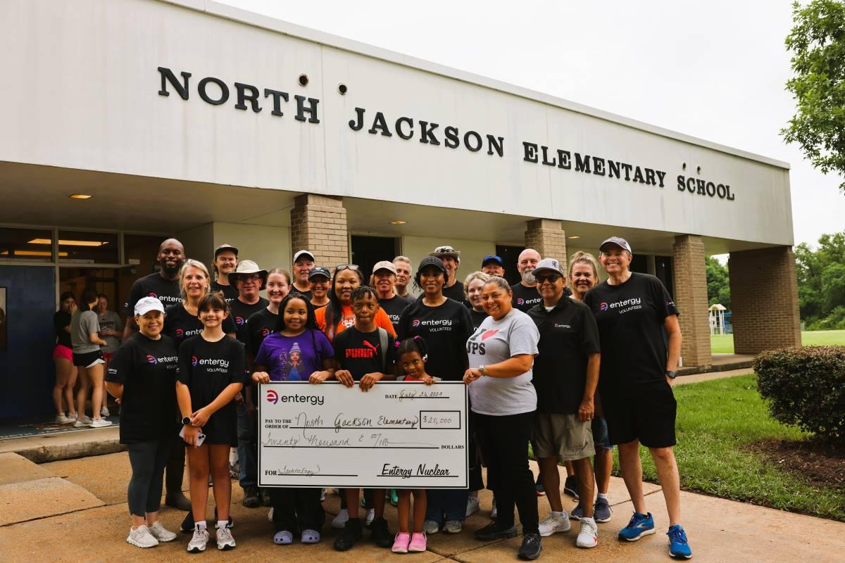 Volunteers gather for the grant presentation after a morning of beautifying North Jackson Elementary School. " "