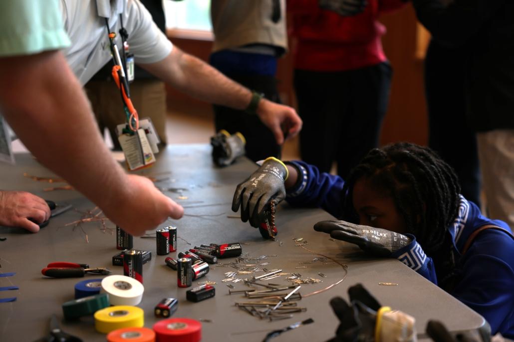 teachers working with students in a classroom
