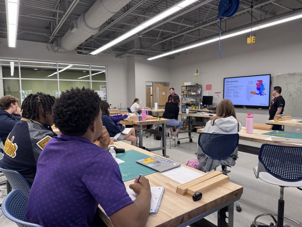 teachers working with students in a classroom