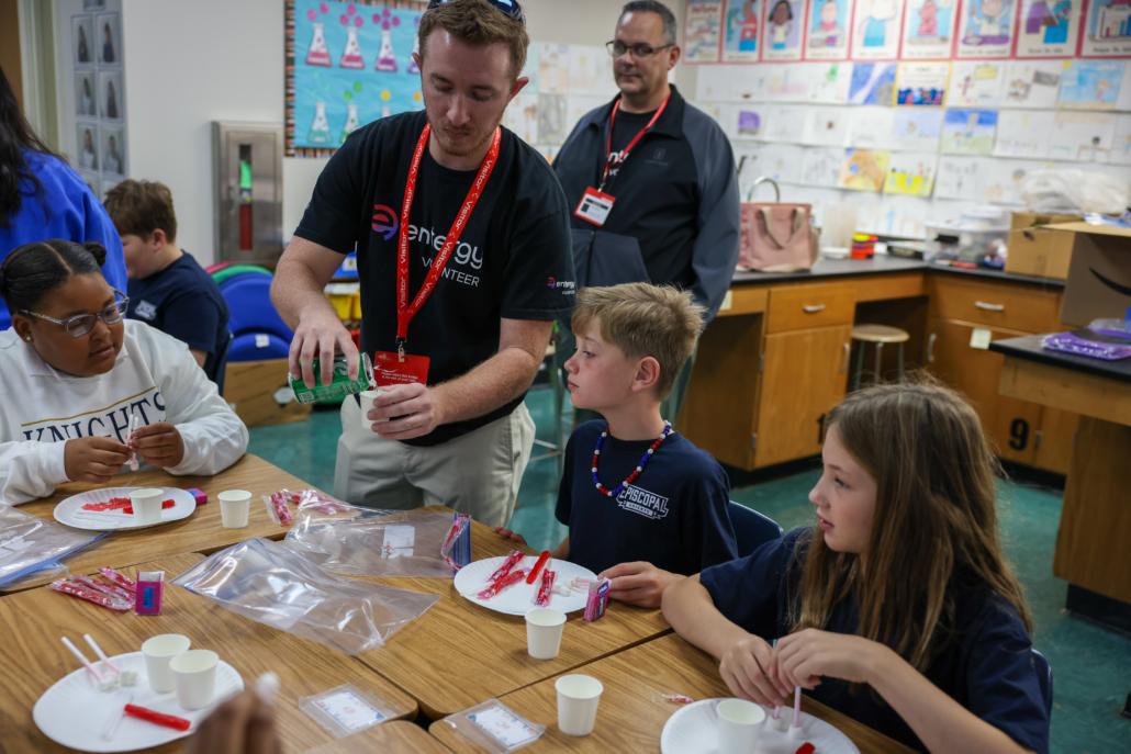 teachers working with students in a classroom