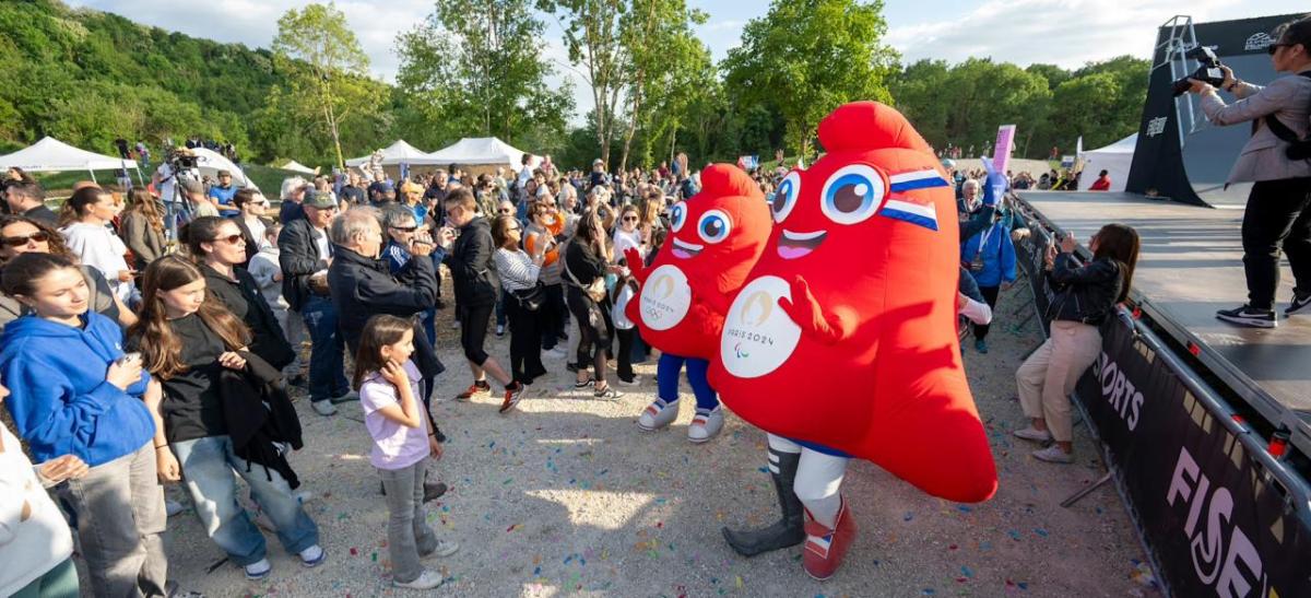mascots with a crowd