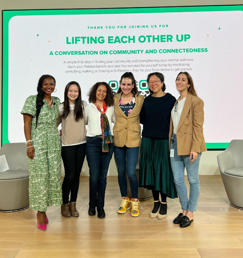 six people standing on a stage