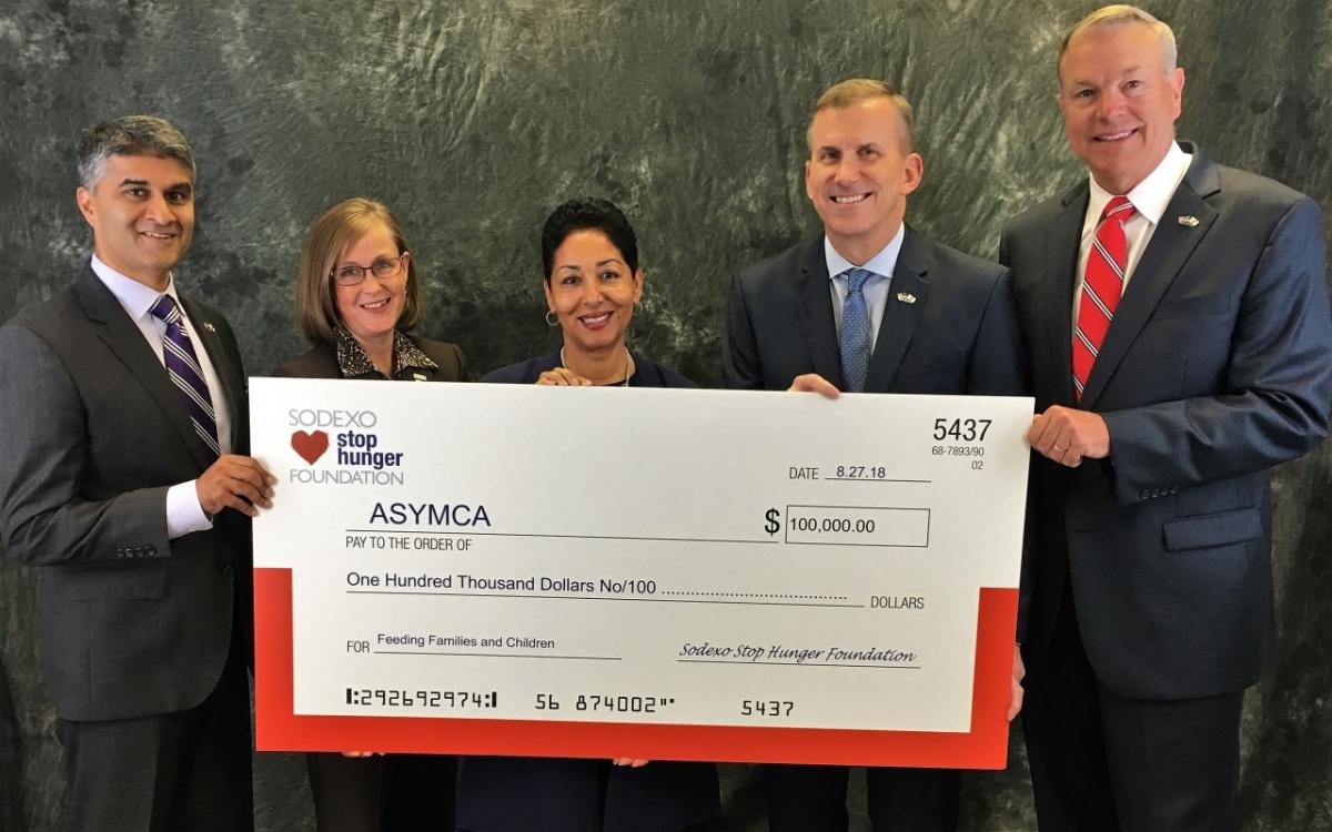 Left to Right: Ashish Vazirani, Chief Development Officer, ASYMCA, Shondra B. Jenkins, Executive Director, Sodexo Stop Hunger Foundation, Gerri Mason Hall, Sodexo Stop Hunger Foundation Chair and Chief Human Resources Officer, Sodexo North America, Charlie Williams, Chief Programs & Operations Officer, ASYMCA, William D. French, President & CEO, ASYMCA. Sodexo Stop Hunger Foundation presented a $100,000 grant check to ASYMCA to help end childhood hunger.