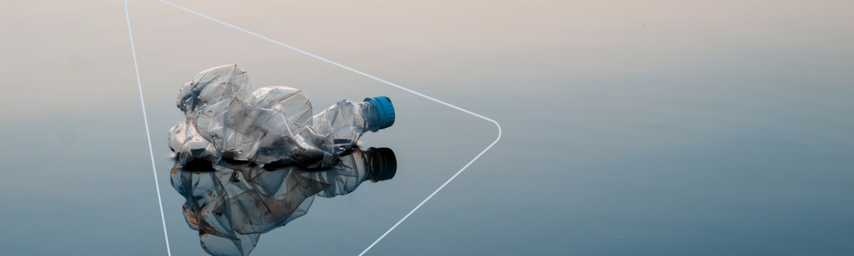 Plastic bottle with a blue lid scrunched up