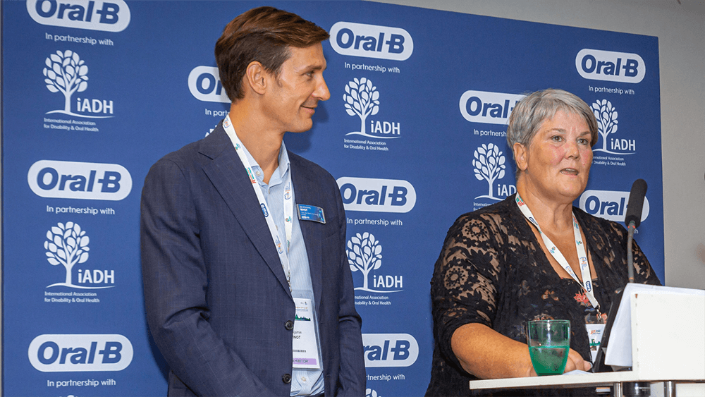 Benjamin Binot and Alison Dougall at a podium