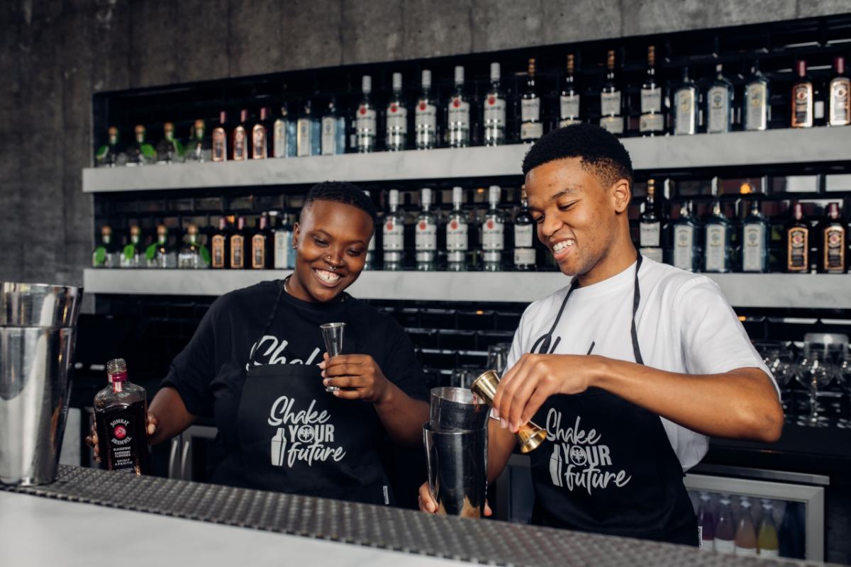 two men behind the bar