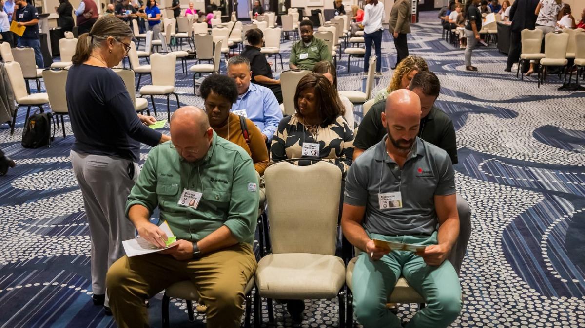 Entergy employees participating in a poverty simulation.