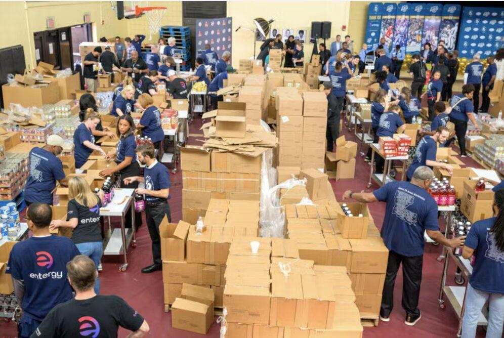 volunteers packing food into boxes