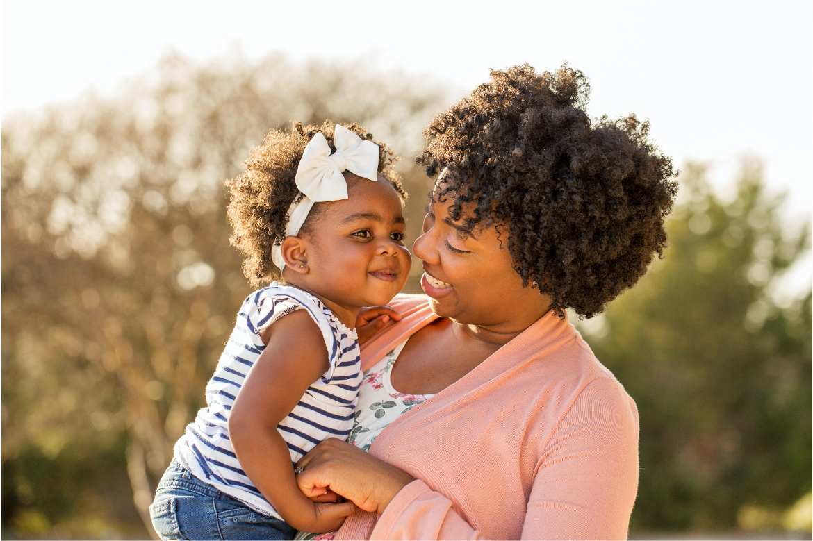 woman holding small child 