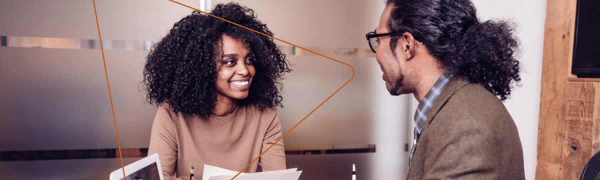 two people talking in an office space