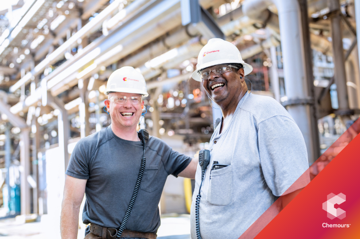 people wearing helmets smiling together