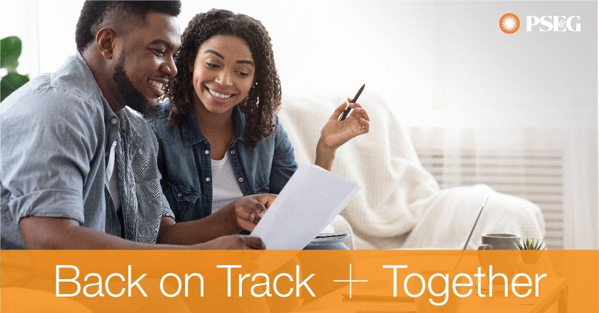 Back on Track Together. Man and woman are looking at a bill together.