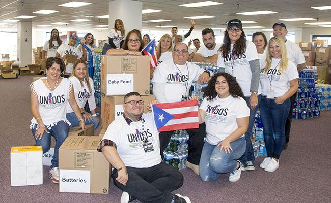 Rafael Babilonia, center, and Unidos por Puerto Rico DMV volunteers work tirelessly to collect supplies to be delivered to the people of Puerto Rico who have been impacted by recent, devastating hurricanes.