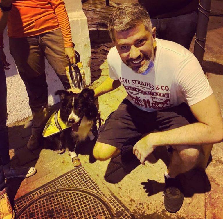 Karim is pictured here with a rescue dog named Flash.