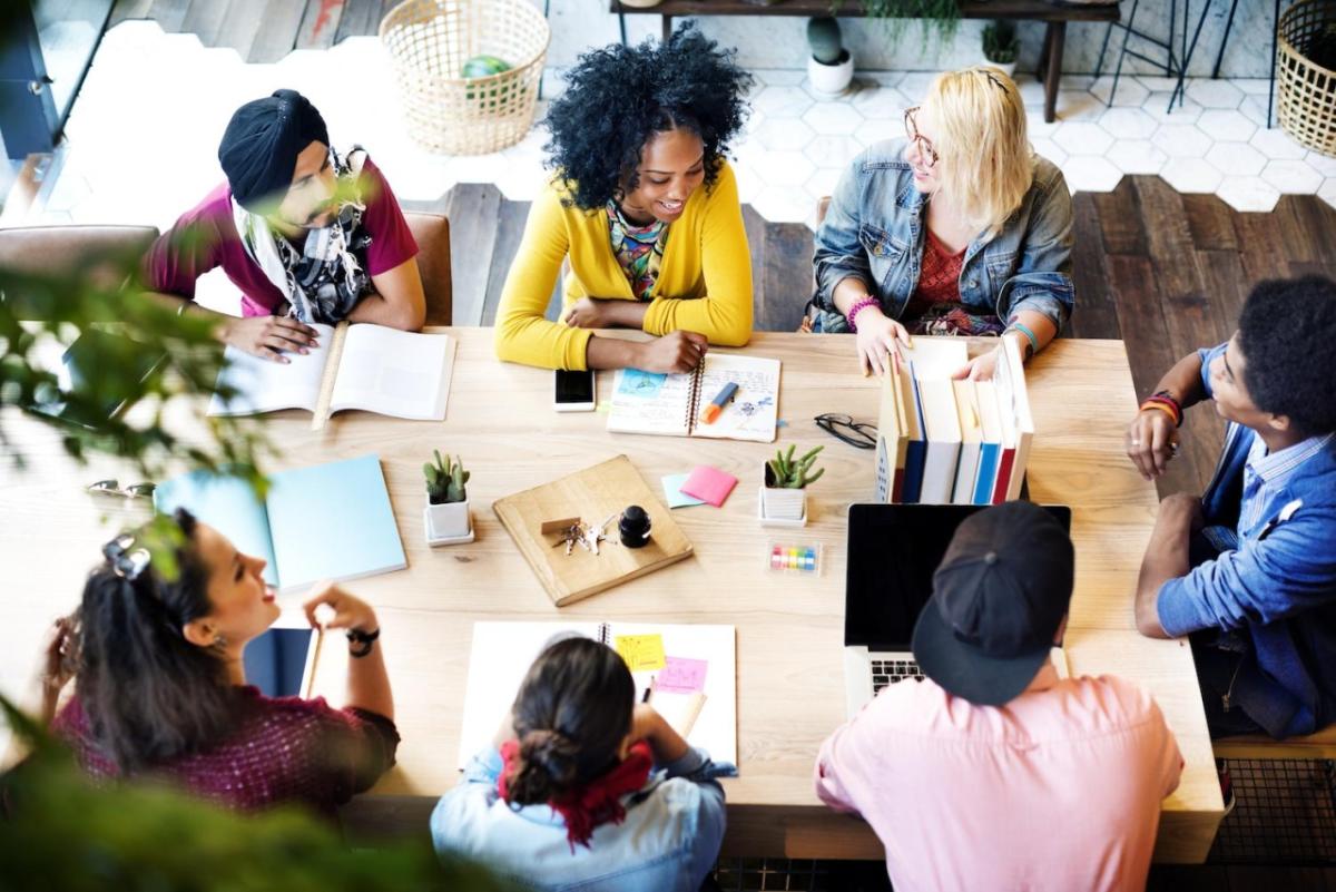 7 people working around a table